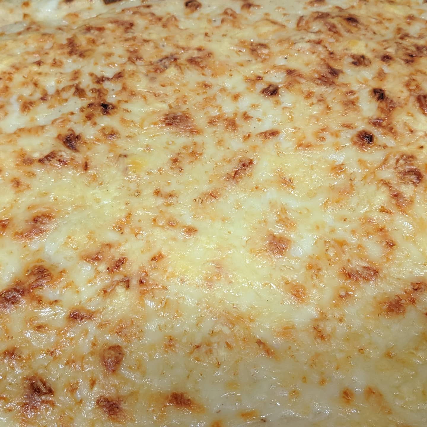 Lasaña de espinacas y champiñones con jamón y bacon